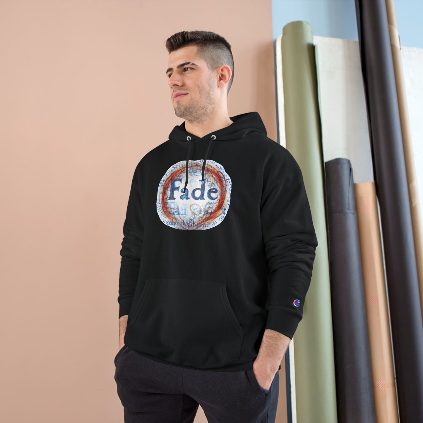 Black unisex hoodie with "Fade" graphic design, worn by a model. A stylish, modern piece perfect for casual streetwear fashion.