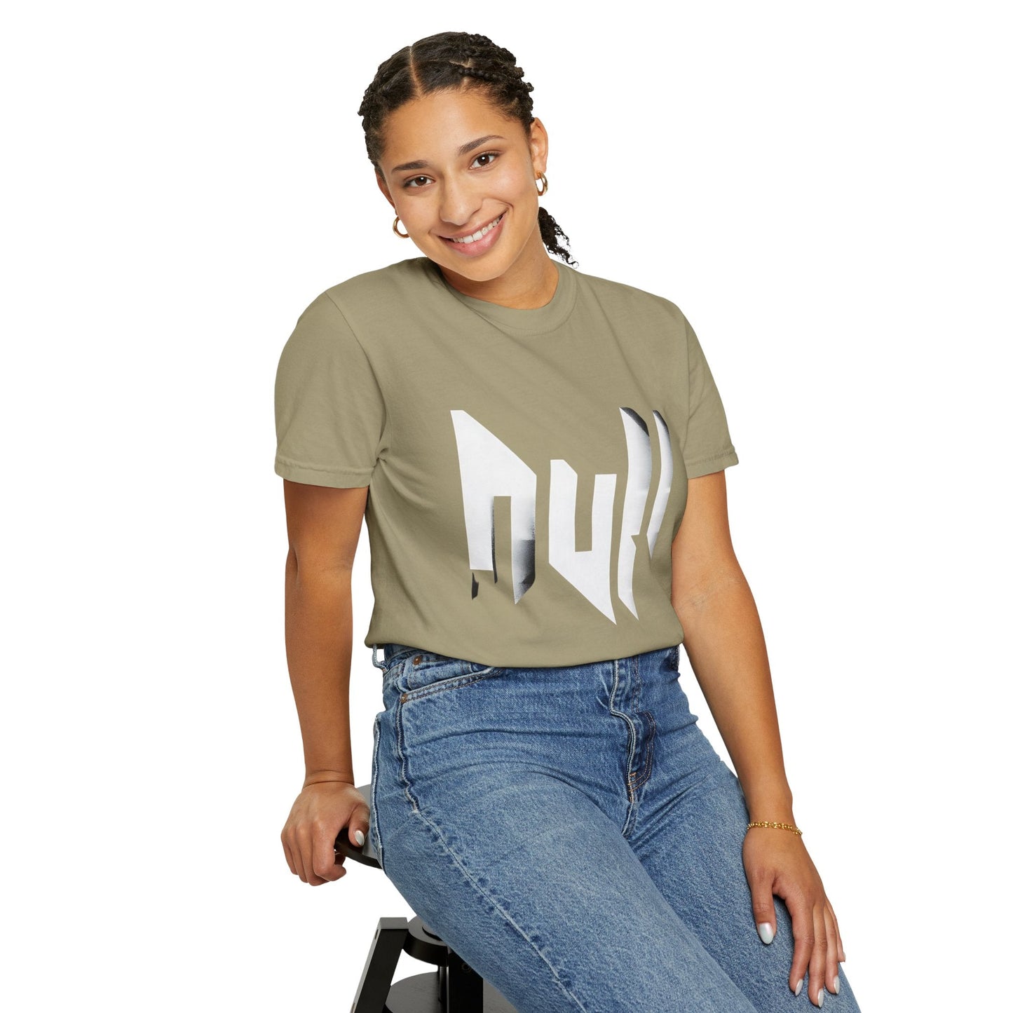 Woman sitting and wearing a khaki unisex T-shirt with bold white “null” graphic in angular font—techwear-inspired street style for casual everyday fashion.