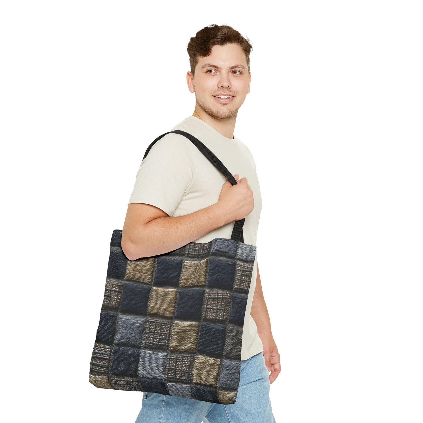 Tote bag featuring a black, brown, and grey checkered patchwork design with textured details, styled by a man in a casual outfit for a unisex aesthetic.