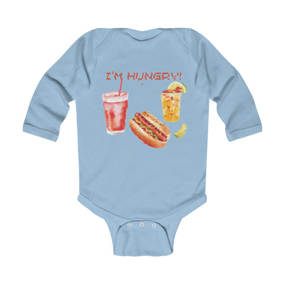 A light blue long-sleeve bodysuit featuring a vibrant illustration of a hot dog and drink with the text "I'M HUNGRY!".