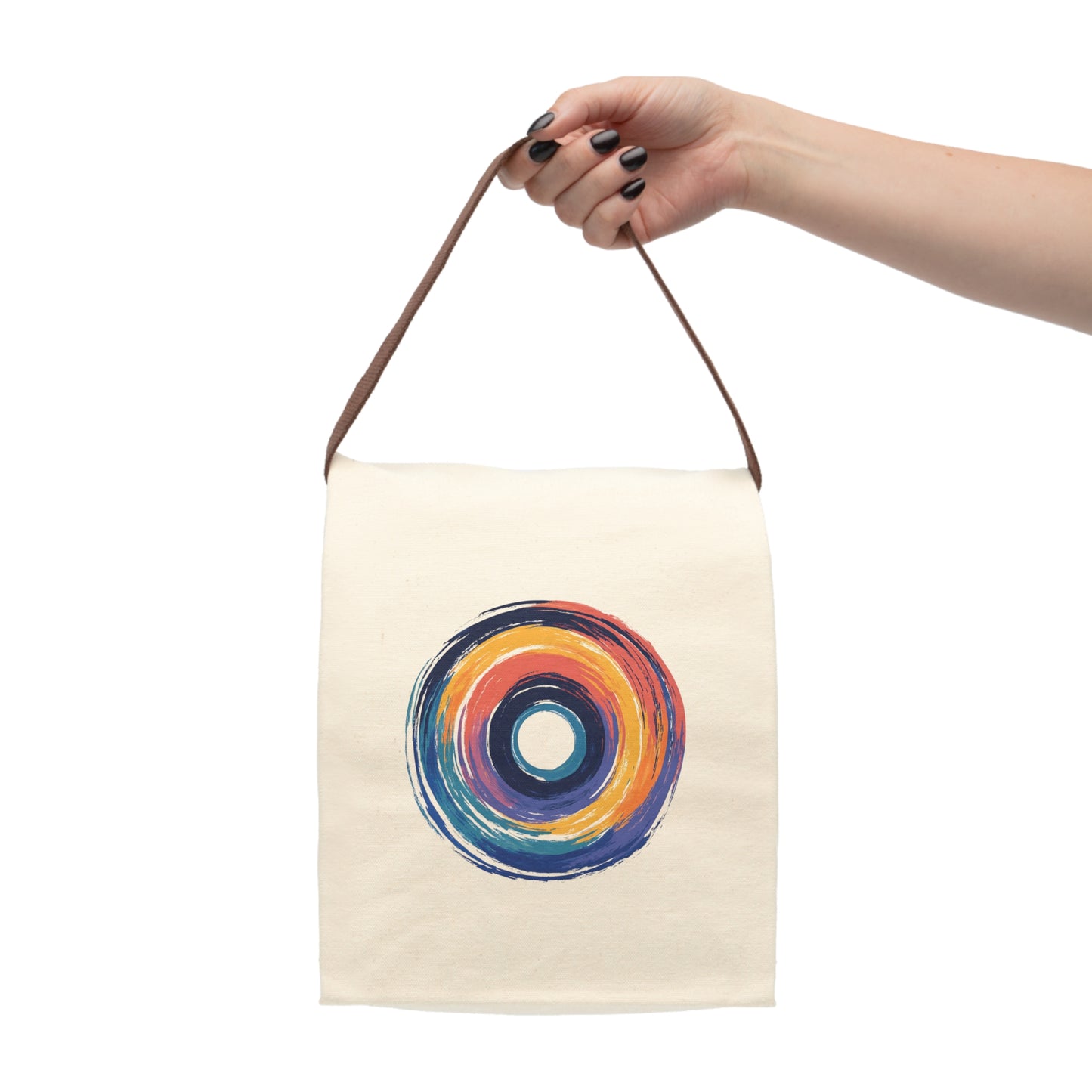 Beige lunch bag and woman's hand with abstract circular design in bright orange, red, yellow and blue brushstrokes.