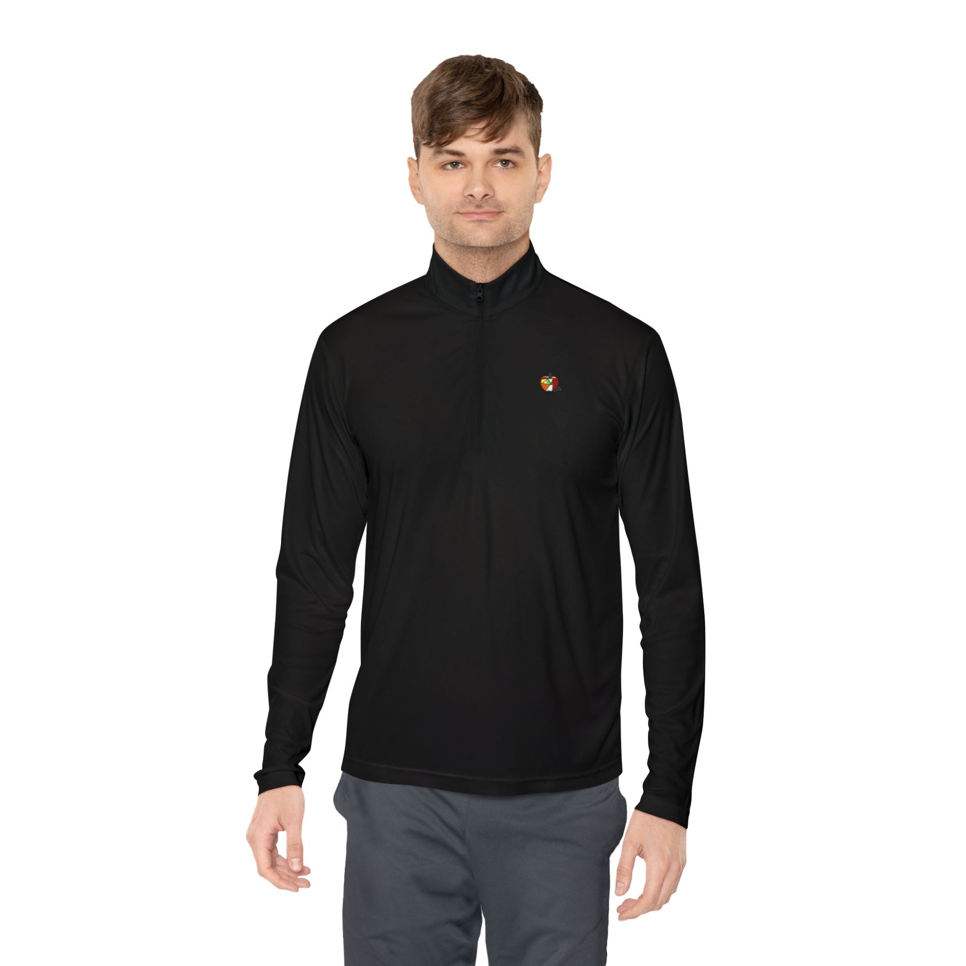 A man wearing a black pullover featuring a subtle yet striking Picasso-style apple design on the left chest.