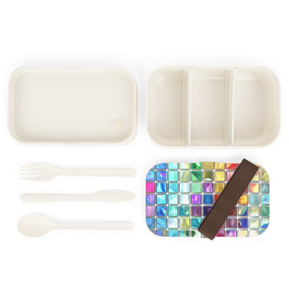 The inside of the vibrant Bento Lunch Box, along with the included fork and spoon.