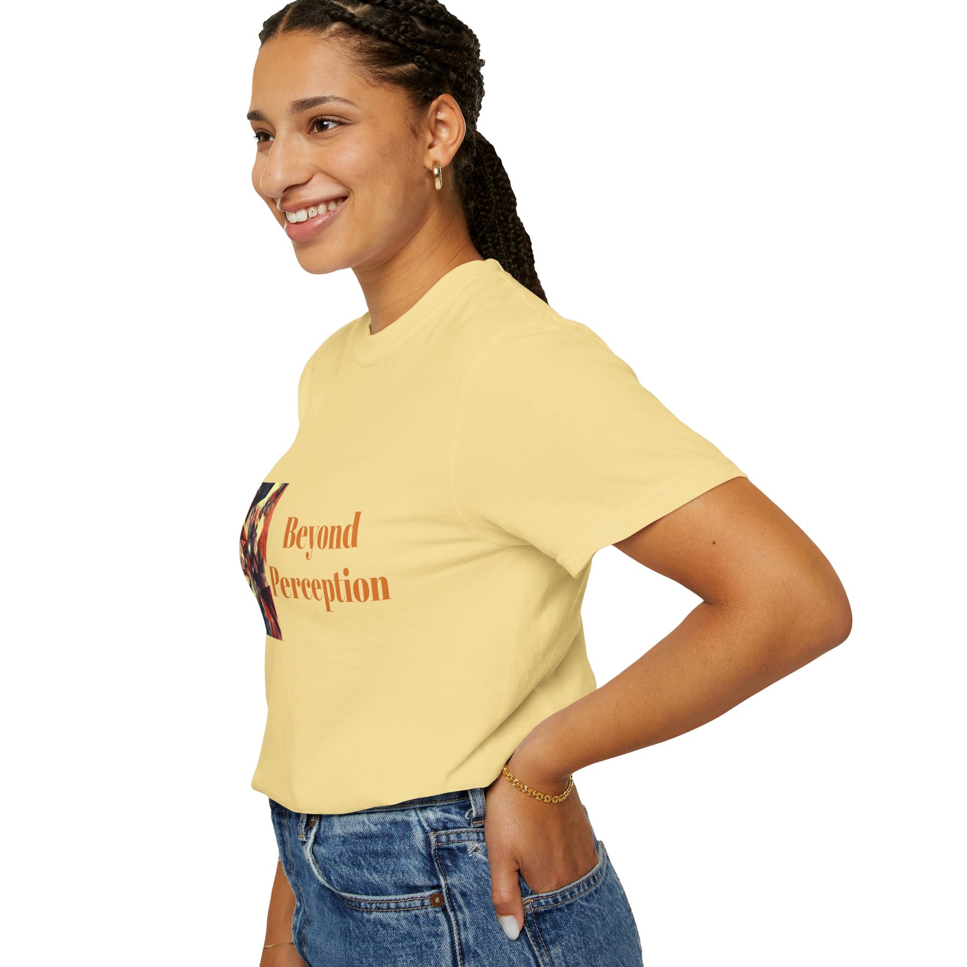 A woman facing left while wearing a butter-colored T-shirt featuring an enchanting abstract design and refined typography.