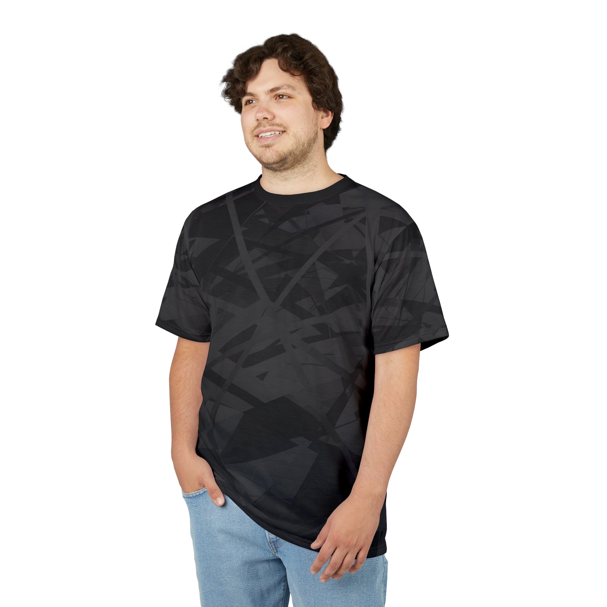 This sophisticated all-over black geometric patterned T-shirt is being worn by a man facing to the right.