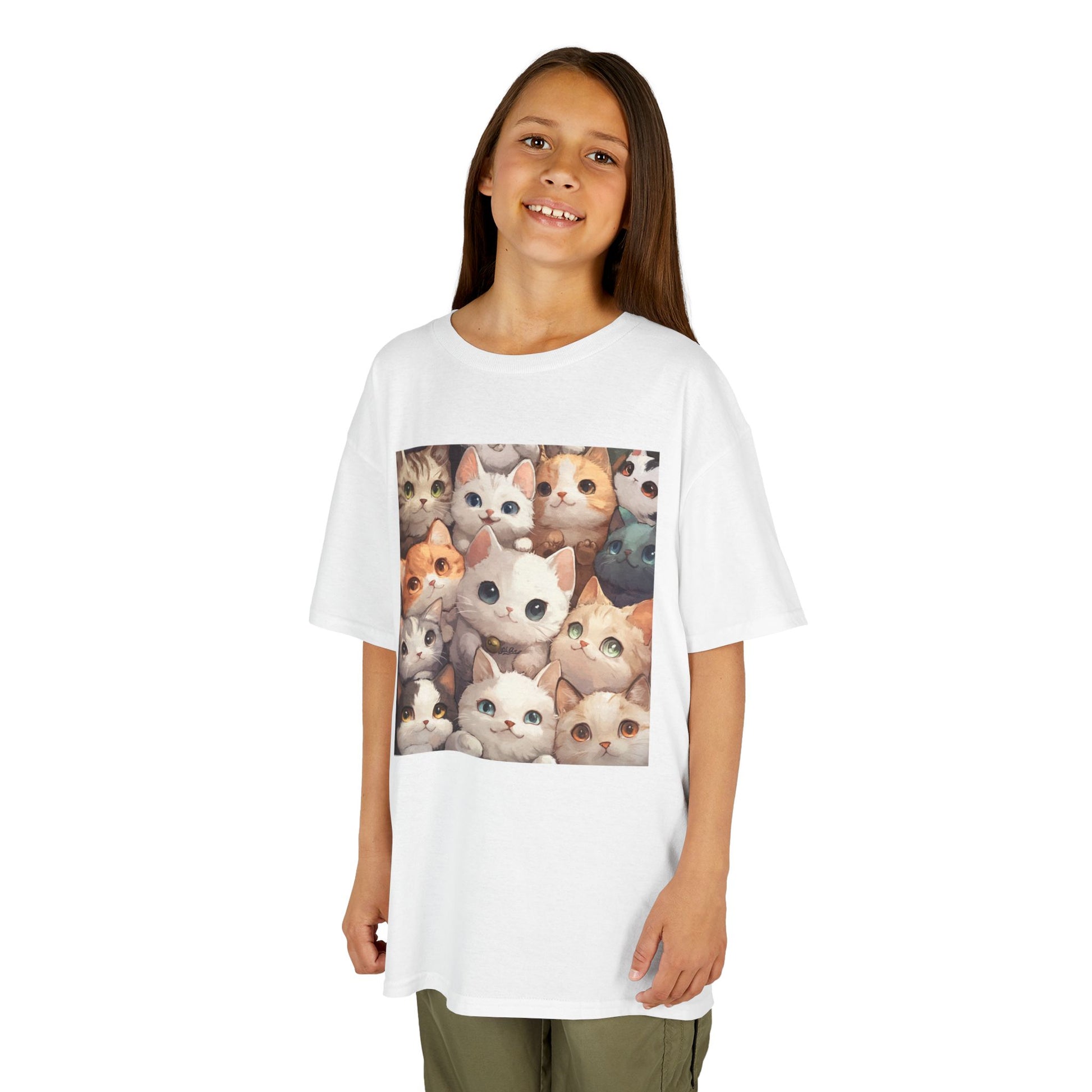 A young girl standing facing forward, wearing a White T-shirt featuring a charming design with an abundance of adorable cats.