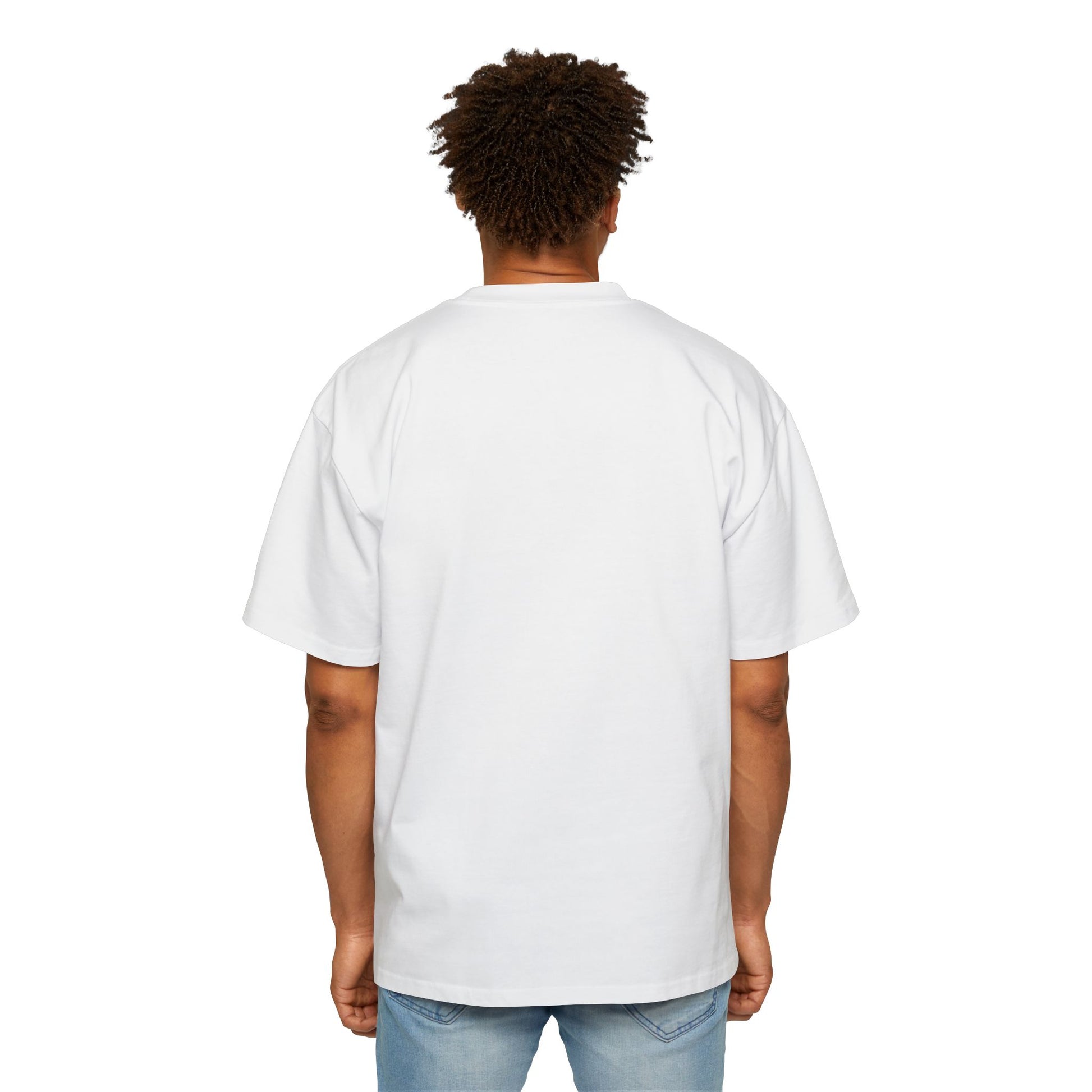 The back view of a man standing and wearing an oversized White T-shirt.
