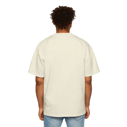 The back view of a man standing and wearing an oversized Butter T-shirt.