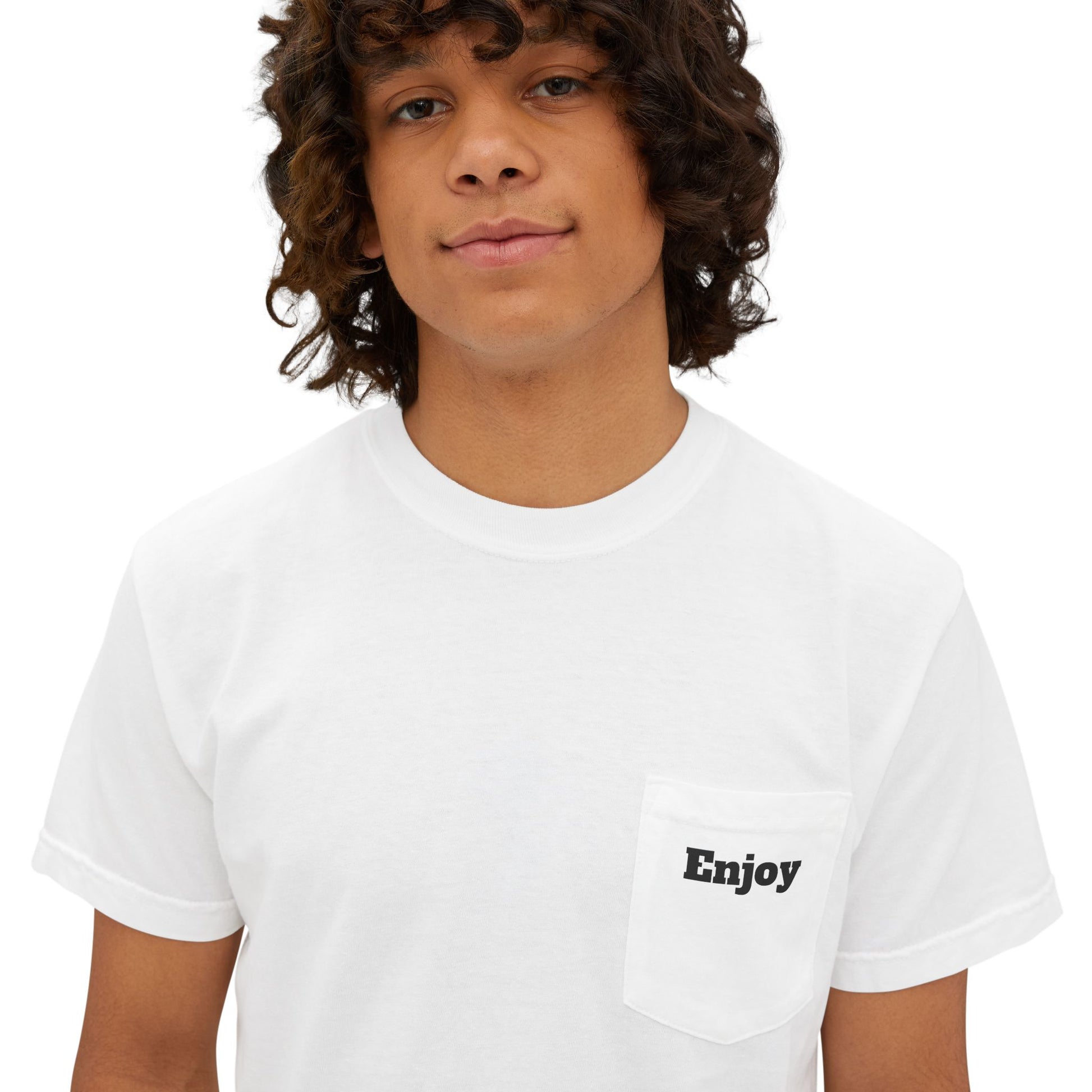 A young man wearing a white T-shirt featuring a small "Enjoy" detail on the front.