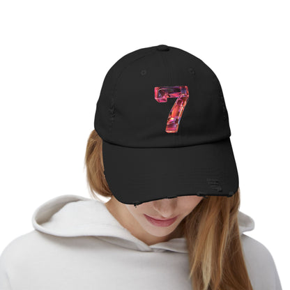 A woman looking down while wearing a distressed Black cap featuring a unique and modern design with a 3D image of the number "7" in a transparent glass style.
