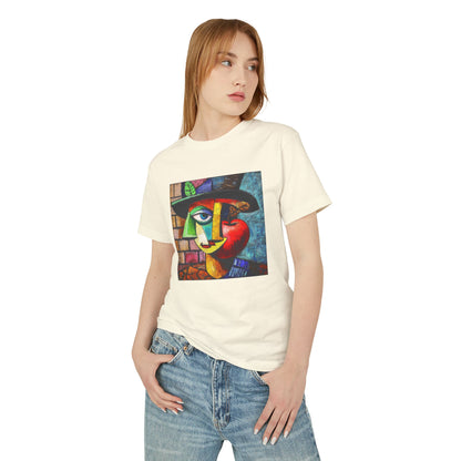 A blonde woman standing and wearing a Faded Cream unisex vintage T-shirt featuring an artistic design with the charm of "Picasso painted an apple."