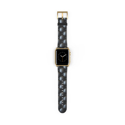 An Apple Watch band in gold matte featuring a beautiful quilted leather-like texture, a square pattern, and delicate button-like details.