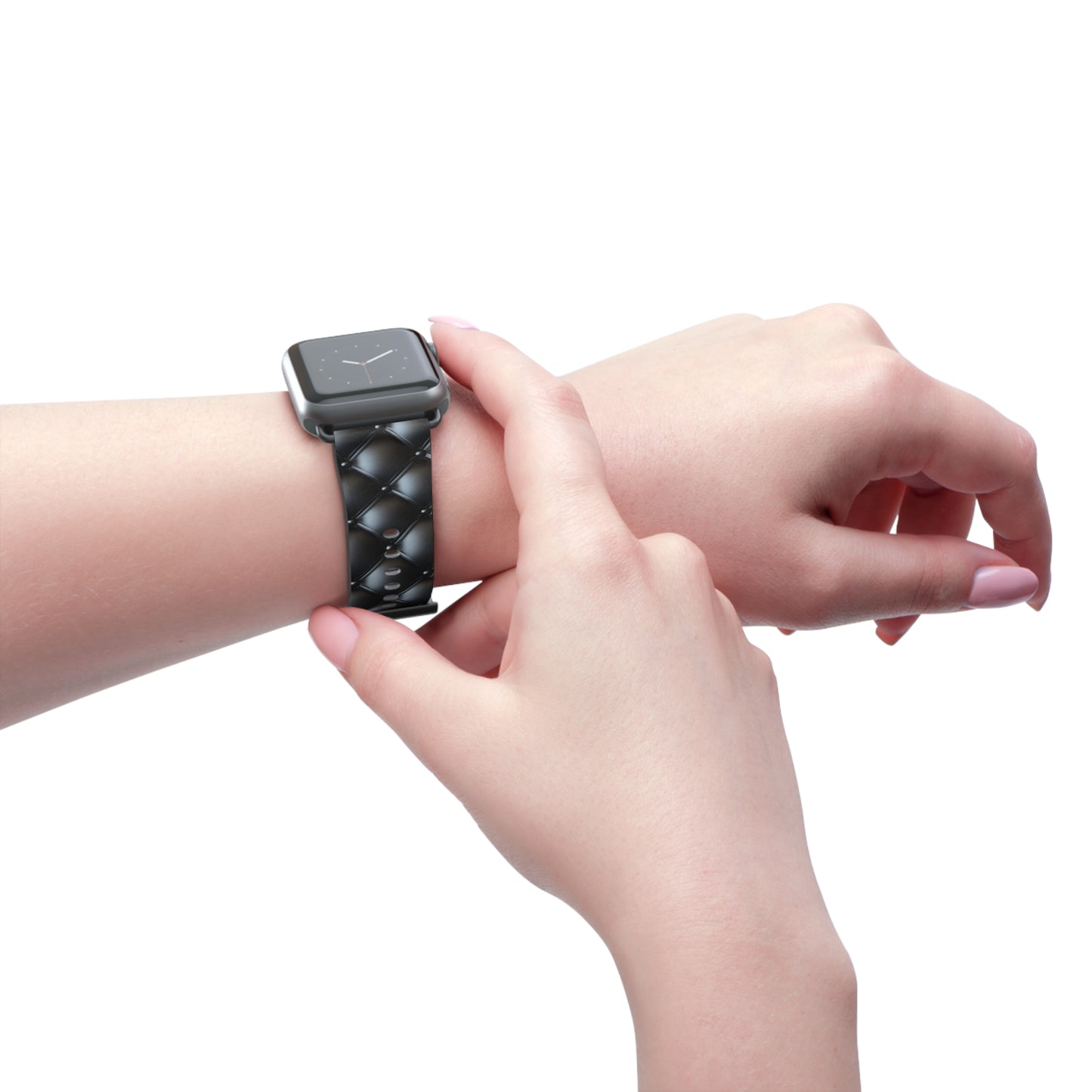 Wearing an Apple Watch band in black matte on the left wrist, featuring a beautiful quilted leather-like texture, a square pattern, and delicate button-like details.