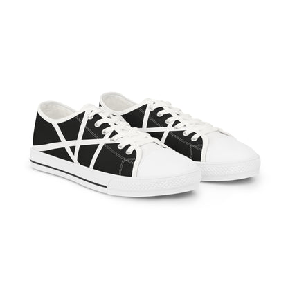 Sneaker with bold black and white abstract geometric pattern.