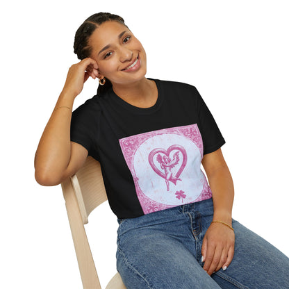 A woman sitting on a chair, resting her elbow on the backrest, wearing a Black T-shirt featuring a vintage 1980s tarot card design with pink risograph and bold gothic typography.
