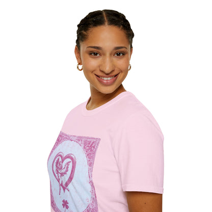 A woman with her body facing left and her face looking forward, wearing a Light Pink T-shirt featuring a vintage 1980s tarot card design with pink risograph and bold gothic typography.