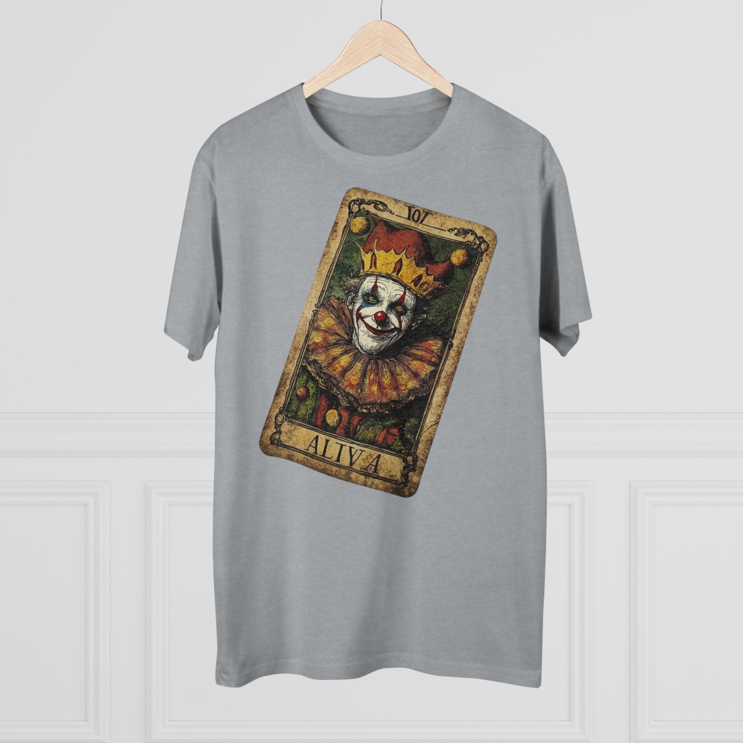 A Light Oxford T-shirt with a unique Tarot card design featuring a clown against a dark grunge-style background, hung on a hanger facing forward.