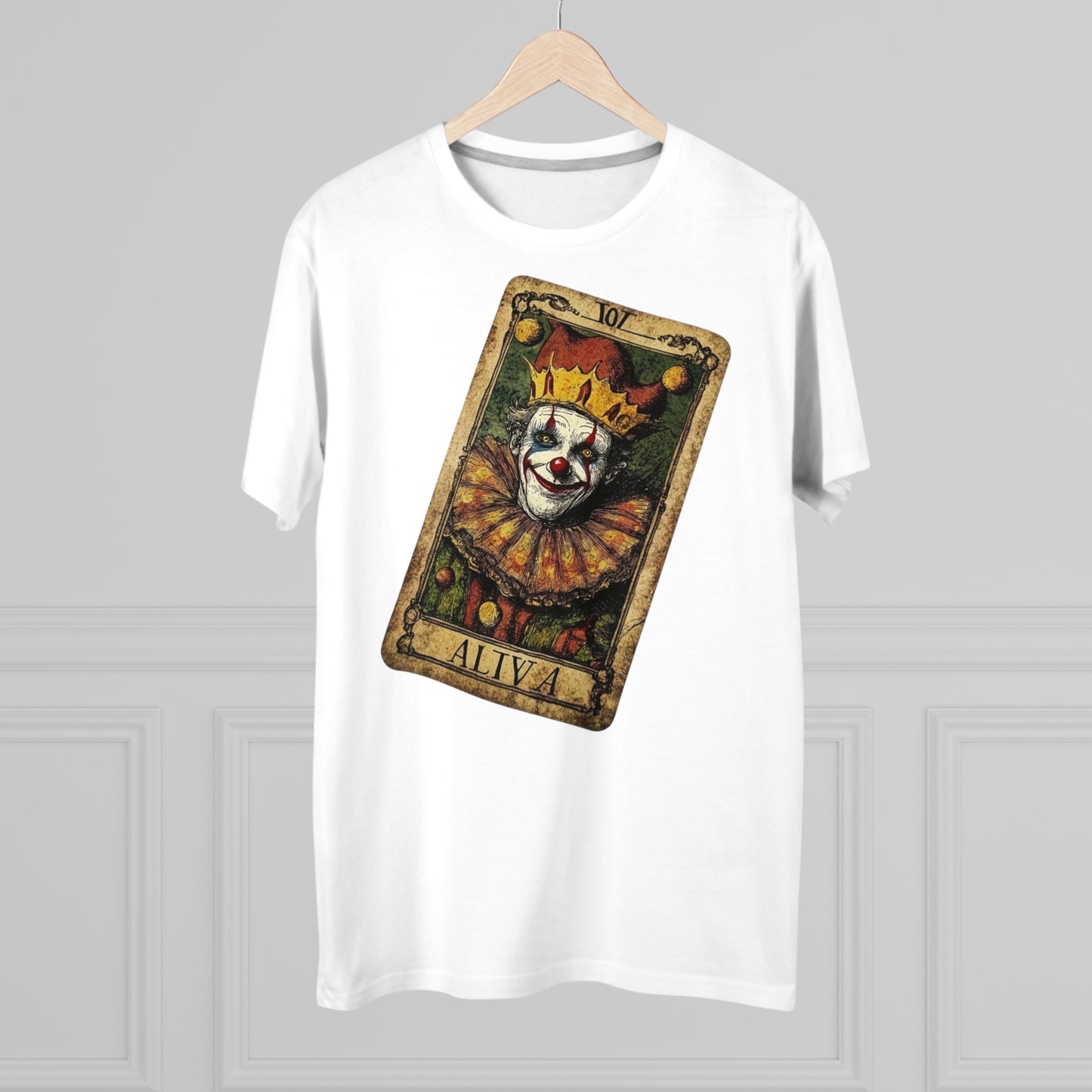 A White T-shirt with a unique Tarot card design featuring a clown against a dark grunge-style background, hung on a hanger facing forward.