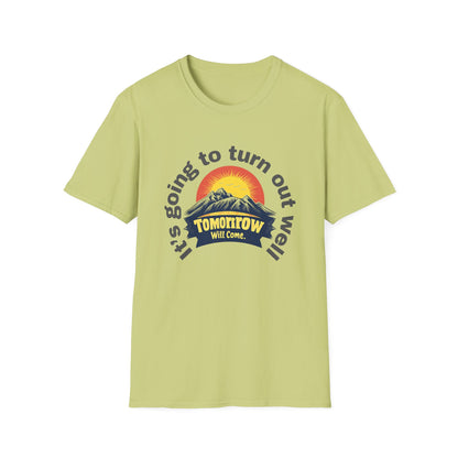 A pistachio-colored T-shirt designed with an uplifting message and a warm sunrise graphic.