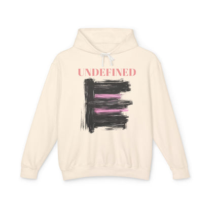 An ivory hoodie featuring bold black brushstrokes with subtle pink accents, enhancing its modern and artistic vibe.