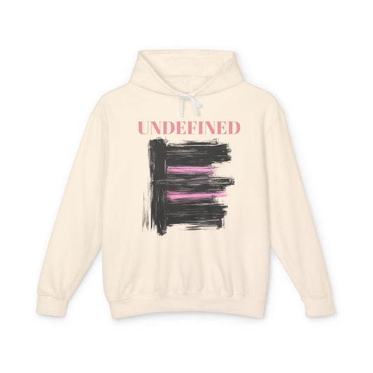 An ivory hoodie featuring bold black brushstrokes with subtle pink accents, enhancing its modern and artistic vibe.