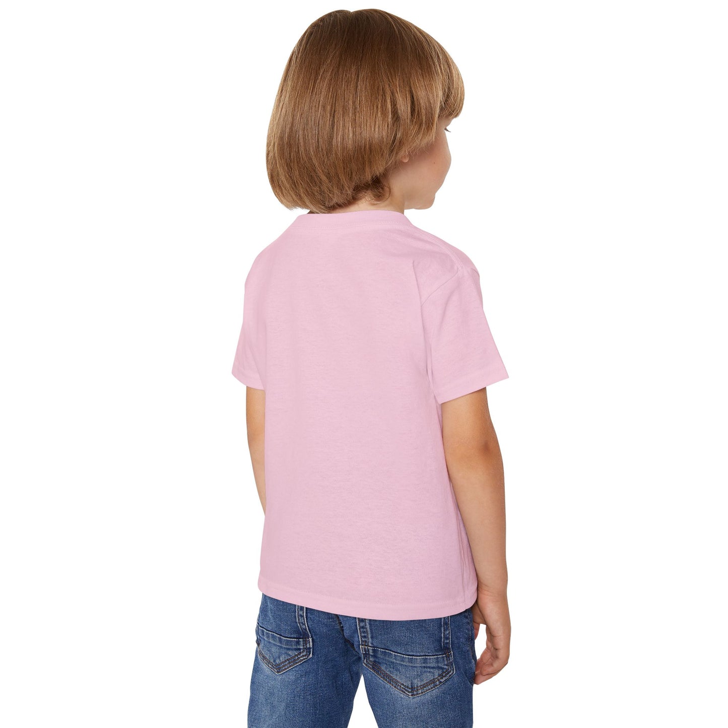 A boy in a light pink T-shirt facing diagonally backward to the right.