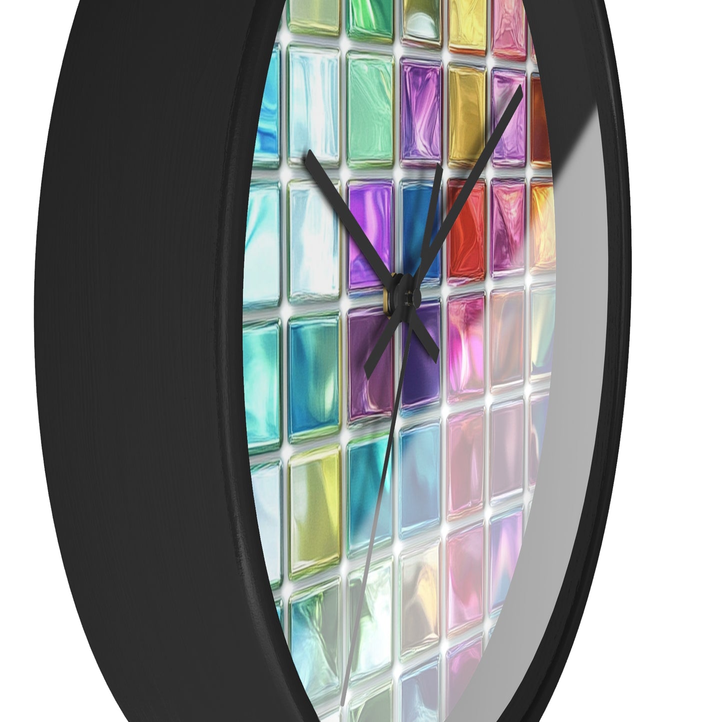 This wall clock has a grid of colorful glass squares like stained glass with black edges and hands, with the left one visible in the foreground.