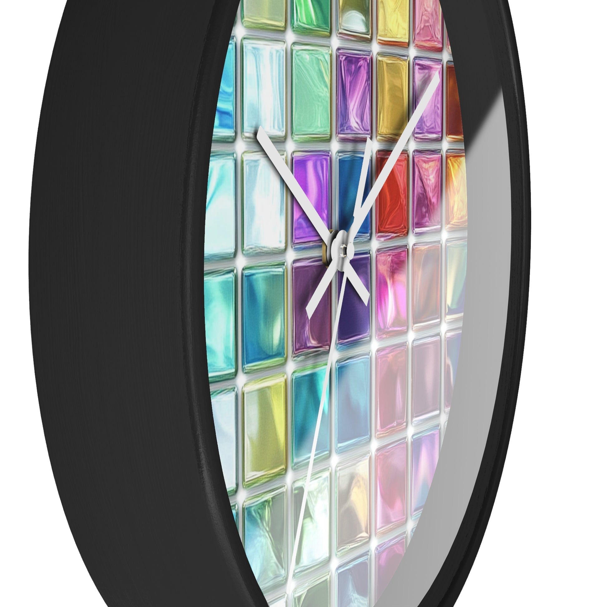 This wall clock features a grid of colorful glass squares like stained glass, with black edges and white hands, with the left side visible in the foreground.