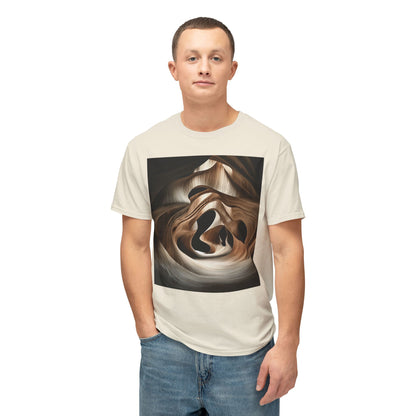 A young man with short hair wearing a natural-colored T-shirt with an abstract, wave-like wood grain design.